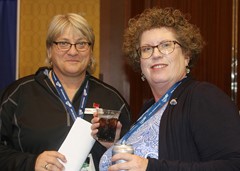CoSIDA Hall of Famers Barb Kowal (CoSIDA) and Shelly Poe (Auburn).